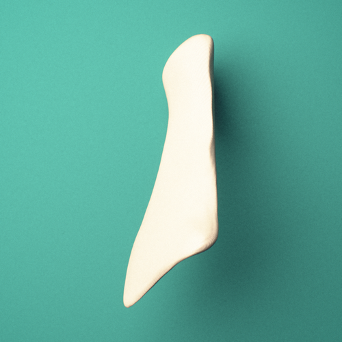 3D-printed Right nasal bone, posterior oblique view showing the midline suture surface.